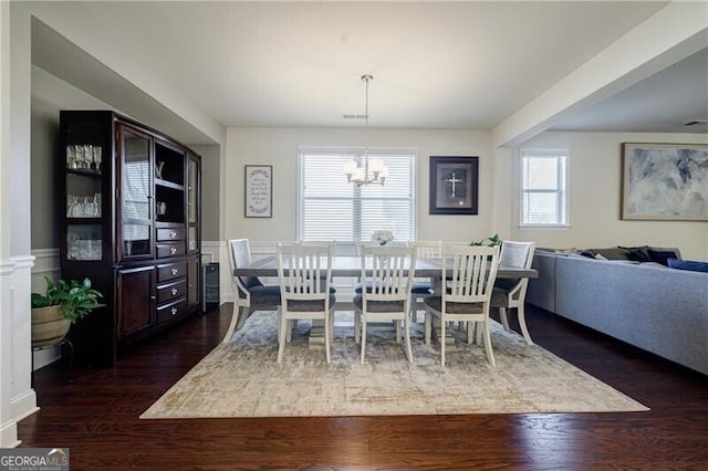 4870 Odum View Ln, Cumming, GA 30040 - dining space featuring a chandelier and dark wood-type flooring