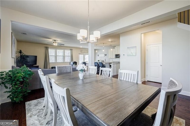 4870 Odum View Ln, Cumming, GA 30040 - dining room featuring a chandelier, dark wood-style flooring, and a ceiling fan