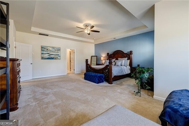 4870 Odum View Ln, Cumming, GA 30040 - carpeted bedroom featuring a tray ceiling and ceiling fan