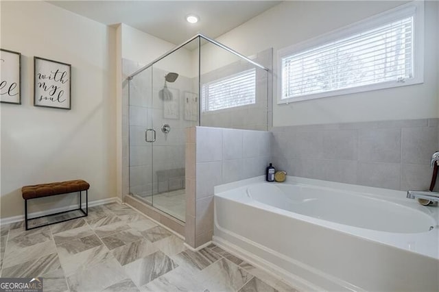 4870 Odum View Ln, Cumming, GA 30040 - bathroom featuring a bath and a stall shower