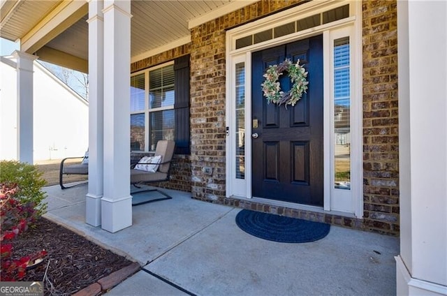 4870 Odum View Ln, Cumming, GA 30040 - view of exterior entry featuring covered porch and brick siding