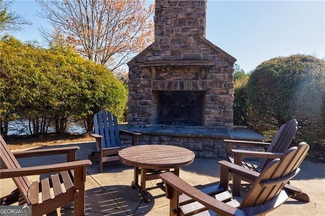 4870 Odum View Ln, Cumming, GA 30040 - view of patio with an outdoor stone fireplace