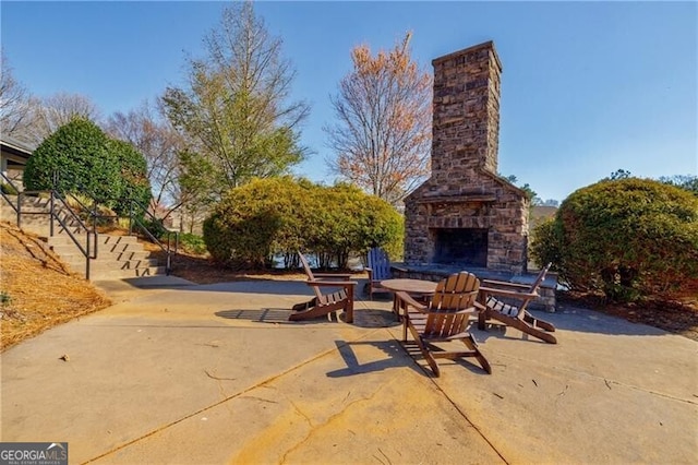 4870 Odum View Ln, Cumming, GA 30040 - view of patio featuring an outdoor stone fireplace