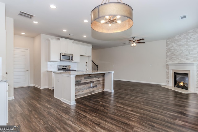 3627 Canyon Springs Dr, Oakwood, GA 30566 - kitchen with a sink, dark wood-type flooring, open floor plan, a ceiling fan, and stainless steel dishwasher