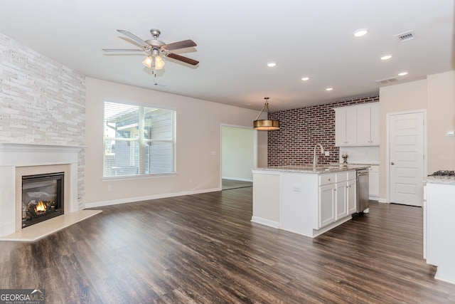 3627 Canyon Springs Dr, Oakwood, GA 30566 - kitchen with a sink, stainless steel appliances, a center island with sink, and dark wood finished floors