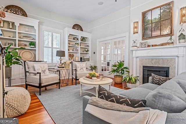 2173 Conyers St SE, Covington, GA 30014 - living area with a fireplace and wood finished floors