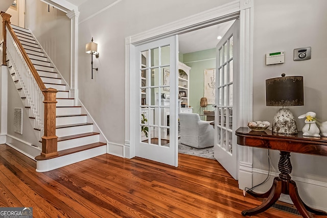 2173 Conyers St SE, Covington, GA 30014 - interior space with french doors, hardwood / wood-style floors, stairway, and baseboards