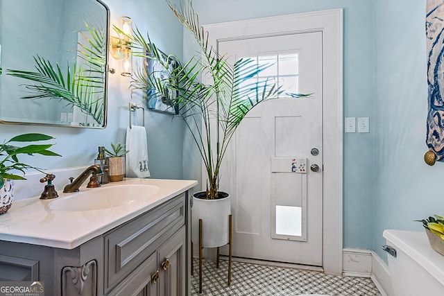 2173 Conyers St SE, Covington, GA 30014 - bathroom with toilet and vanity