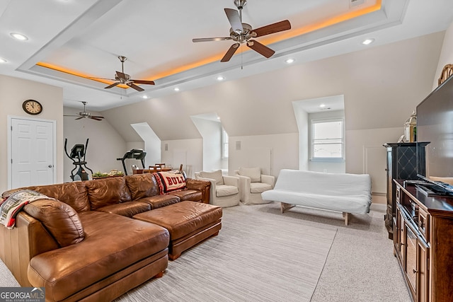 2173 Conyers St SE, Covington, GA 30014 - carpeted living area featuring a raised ceiling, ceiling fan, recessed lighting, and vaulted ceiling