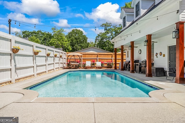 2173 Conyers St SE, Covington, GA 30014 - view of swimming pool with a fenced backyard and a patio
