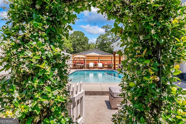 2173 Conyers St SE, Covington, GA 30014 - view of swimming pool with a fenced backyard and a gazebo