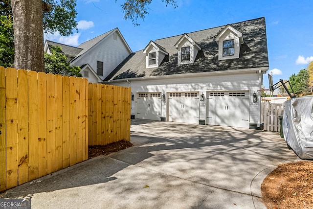 2173 Conyers St SE, Covington, GA 30014 - garage featuring concrete driveway and fence
