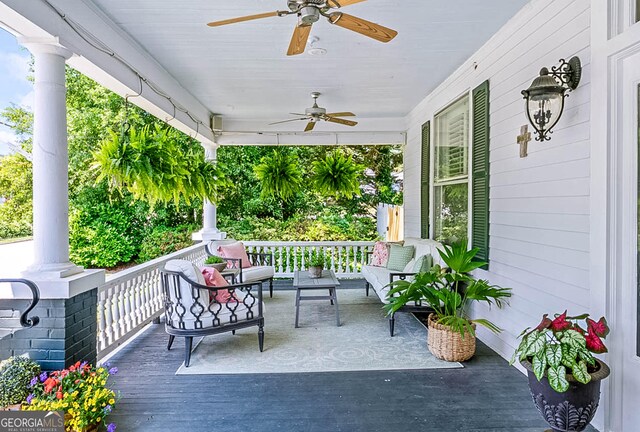 2173 Conyers St SE, Covington, GA 30014 - wooden deck featuring covered porch, a ceiling fan, and outdoor lounge area