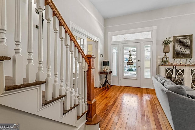 2173 Conyers St SE, Covington, GA 30014 - foyer entrance with light wood-style flooring and stairs