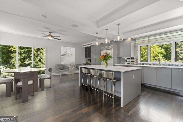 4 W Wesley Rdg NW, Atlanta, GA 30327 - kitchen with gray cabinetry, a kitchen island, a kitchen bar, plenty of natural light, and recessed lighting