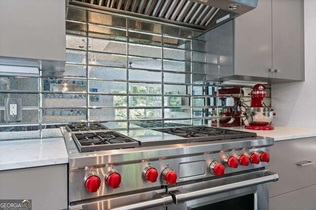 4 W Wesley Rdg NW, Atlanta, GA 30327 - kitchen featuring range with two ovens, backsplash, light countertops, and gray cabinets