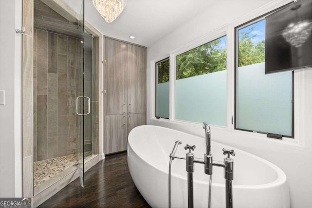 4 W Wesley Rdg NW, Atlanta, GA 30327 - bathroom with a stall shower, wood finished floors, a soaking tub, and recessed lighting