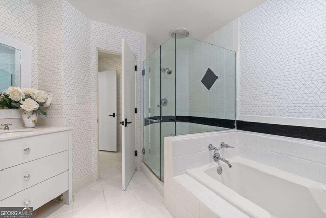 4 W Wesley Rdg NW, Atlanta, GA 30327 - bathroom with a shower stall, a garden tub, vanity, tile walls, and tile patterned flooring