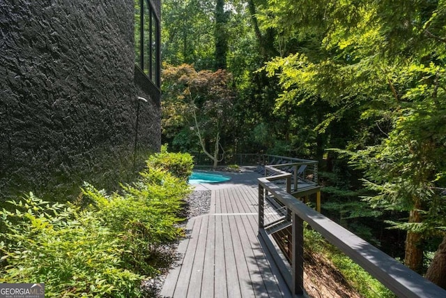 4 W Wesley Rdg NW, Atlanta, GA 30327 - deck featuring an outdoor pool and a wooded view