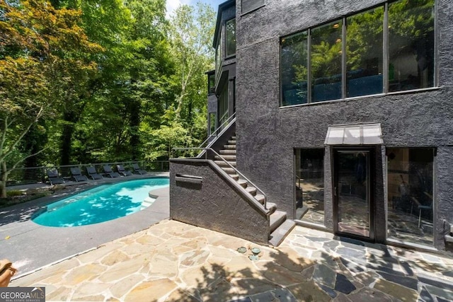 4 W Wesley Rdg NW, Atlanta, GA 30327 - view of swimming pool with stairs and a patio area