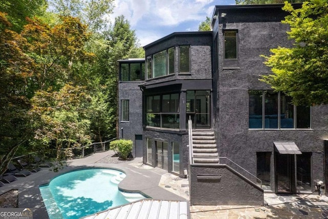 4 W Wesley Rdg NW, Atlanta, GA 30327 - rear view of property with stairs, stucco siding, and a patio
