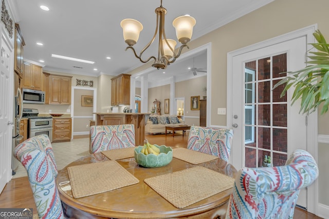 11 Creekwood Dr, Dublin, GA 31021 - dining room with baseboards, recessed lighting, crown molding, and ceiling fan with notable chandelier
