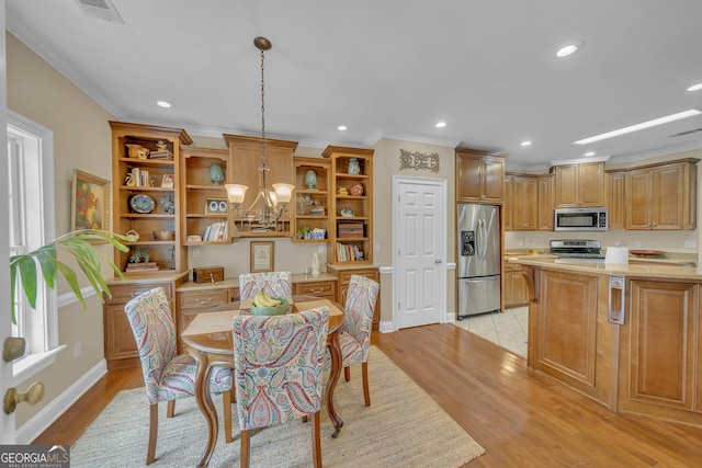 11 Creekwood Dr, Dublin, GA 31021 - dining area with crown molding, a chandelier, visible vents, light wood-style floors, and recessed lighting