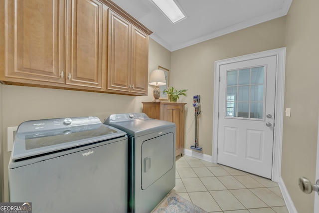 11 Creekwood Dr, Dublin, GA 31021 - washroom with washer and clothes dryer, crown molding, light tile patterned floors, baseboards, and cabinet space