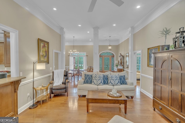11 Creekwood Dr, Dublin, GA 31021 - living area featuring light wood finished floors, ceiling fan with notable chandelier, ornamental molding, and a wealth of natural light