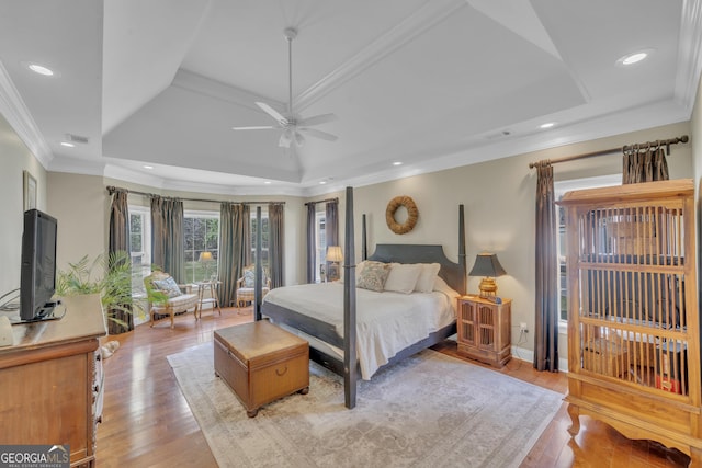 11 Creekwood Dr, Dublin, GA 31021 - bedroom featuring visible vents, crown molding, light wood finished floors, recessed lighting, and a tray ceiling