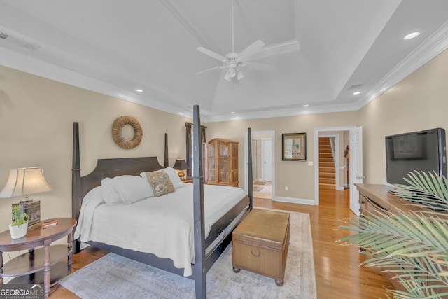 11 Creekwood Dr, Dublin, GA 31021 - bedroom featuring light wood finished floors, recessed lighting, ornamental molding, and a raised ceiling