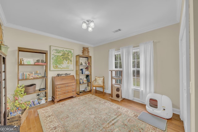 11 Creekwood Dr, Dublin, GA 31021 - living area featuring baseboards, visible vents, crown molding, and wood finished floors