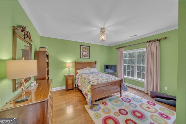 11 Creekwood Dr, Dublin, GA 31021 - bedroom with baseboards, visible vents, ornamental molding, and wood finished floors