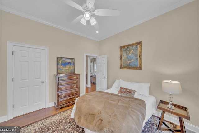 11 Creekwood Dr, Dublin, GA 31021 - bedroom featuring baseboards, crown molding, wood finished floors, and ceiling fan