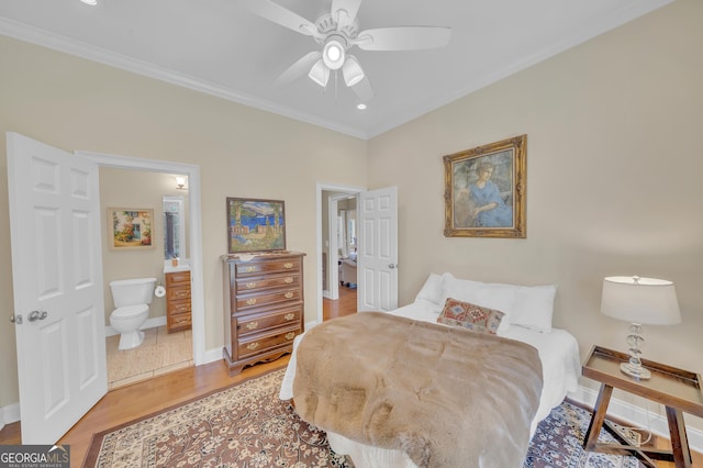 11 Creekwood Dr, Dublin, GA 31021 - bedroom with ensuite bathroom, baseboards, light wood-type flooring, and ornamental molding