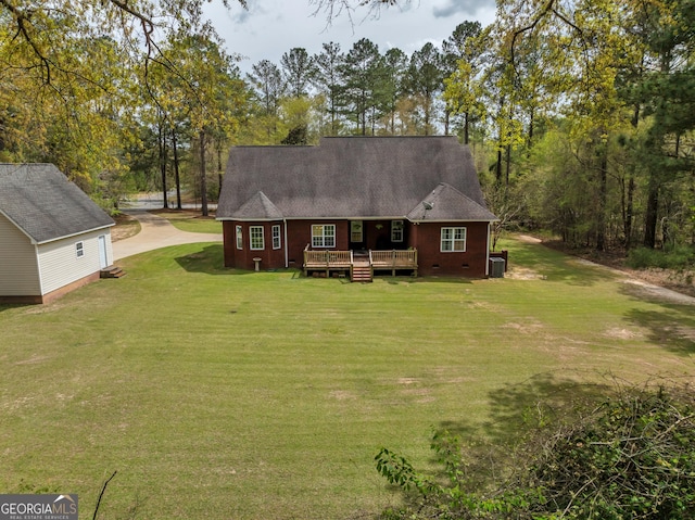 11 Creekwood Dr, Dublin, GA 31021 - view of front of home with driveway, a front lawn, and a wooden deck