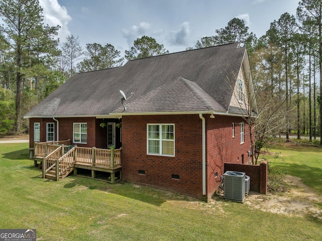 11 Creekwood Dr, Dublin, GA 31021 - back of property featuring central air condition unit, a wooden deck, brick siding, roof with shingles, and a lawn