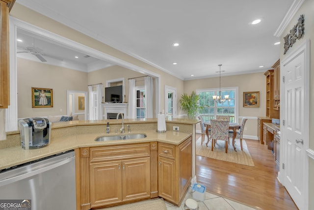 11 Creekwood Dr, Dublin, GA 31021 - kitchen with a fireplace, a sink, crown molding, and dishwasher