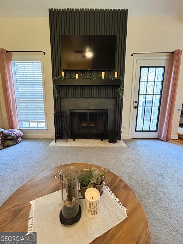 924 Morningside Dr, Griffin, GA 30224 - carpeted living room with a brick fireplace and baseboards