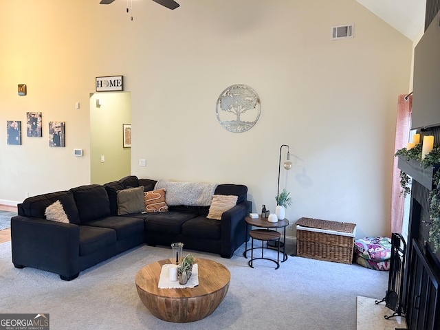 924 Morningside Dr, Griffin, GA 30224 - carpeted living area with high vaulted ceiling, a ceiling fan, and a fireplace