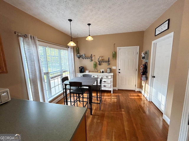 924 Morningside Dr, Griffin, GA 30224 - dining area with dark wood finished floors and a textured ceiling