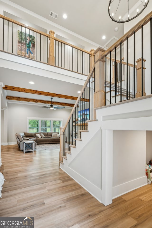 4426 Oxburgh Park, Flowery Branch, GA 30542 - staircase featuring recessed lighting, a chandelier, a high ceiling, wood finished floors, and ornamental molding