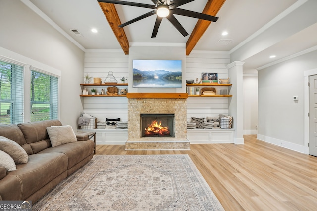 4426 Oxburgh Park, Flowery Branch, GA 30542 - living room with a ceiling fan, light wood-type flooring, beamed ceiling, a fireplace, and ornamental molding