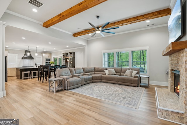 4426 Oxburgh Park, Flowery Branch, GA 30542 - living area featuring beamed ceiling, a fireplace, a ceiling fan, recessed lighting, and light wood-style floors