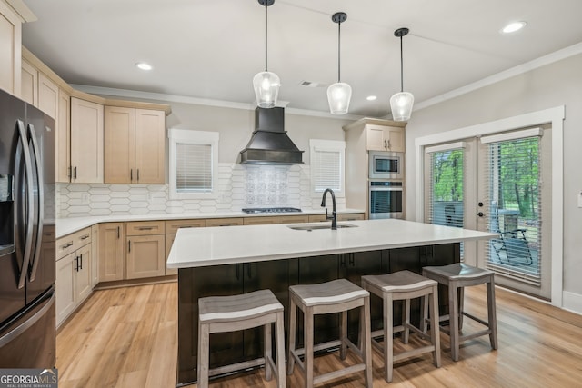 4426 Oxburgh Park, Flowery Branch, GA 30542 - kitchen with appliances with stainless steel finishes, custom range hood, light countertops, a breakfast bar, and light wood-type flooring