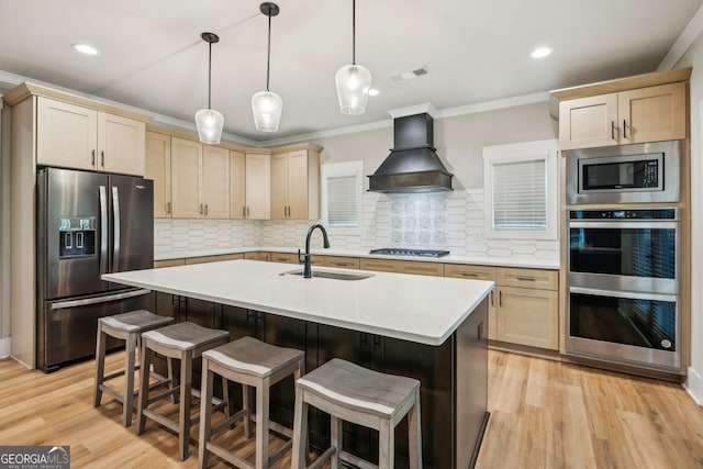 4426 Oxburgh Park, Flowery Branch, GA 30542 - kitchen with appliances with stainless steel finishes, custom range hood, light countertops, ornamental molding, and light wood-type flooring