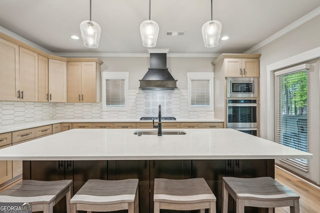 4426 Oxburgh Park, Flowery Branch, GA 30542 - kitchen with stainless steel appliances, custom exhaust hood, light countertops, ornamental molding, and light brown cabinets