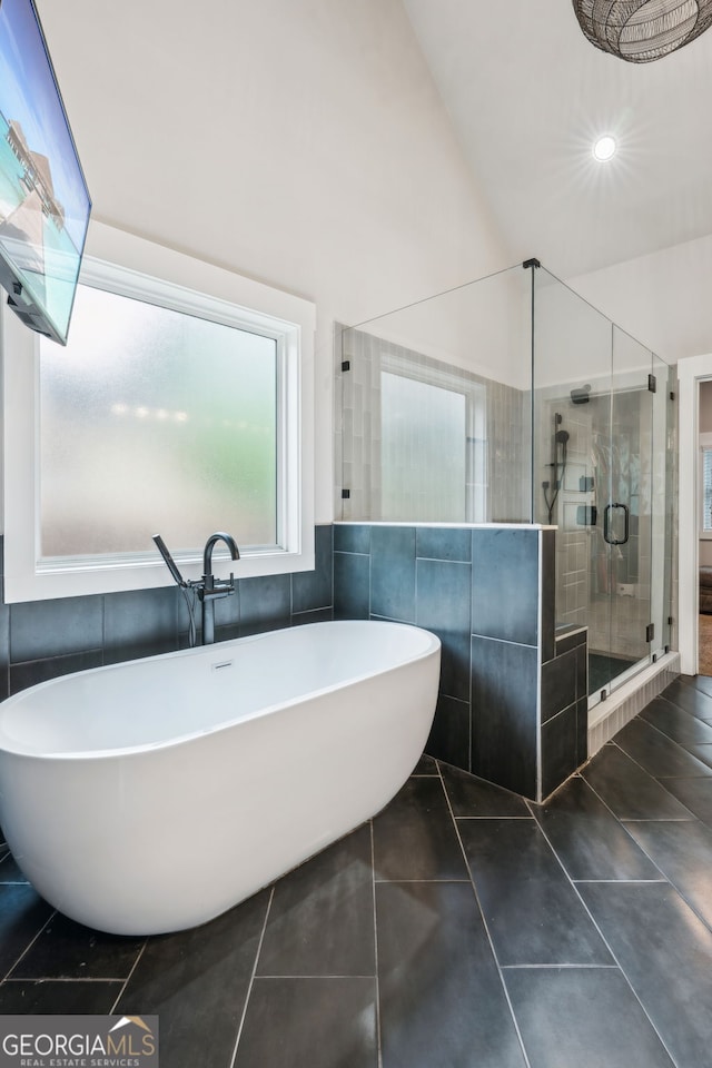 4426 Oxburgh Park, Flowery Branch, GA 30542 - bathroom with a shower stall, a freestanding bath, tile walls, tile patterned floors, and recessed lighting