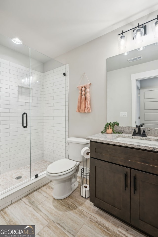 4426 Oxburgh Park, Flowery Branch, GA 30542 - bathroom featuring vanity, a stall shower, and wood finished floors