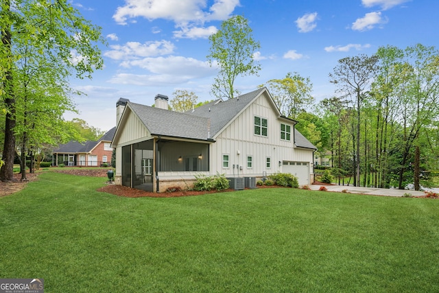 4426 Oxburgh Park, Flowery Branch, GA 30542 - view of home's exterior with board and batten siding, driveway, a chimney, and a lawn